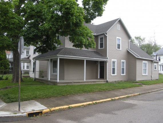 front porch, shade tree and side of home