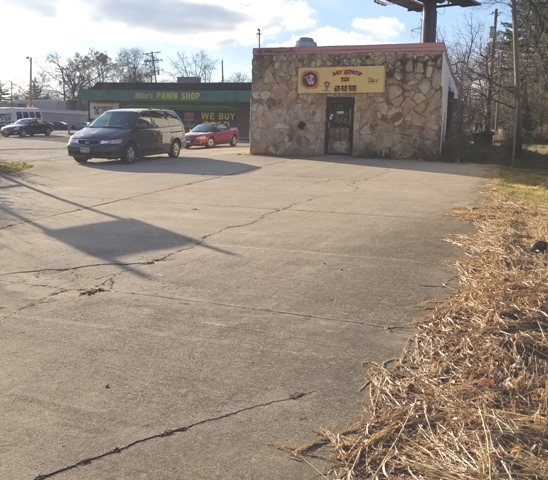 High Visibility Front Entrance & Concrete Parking Area