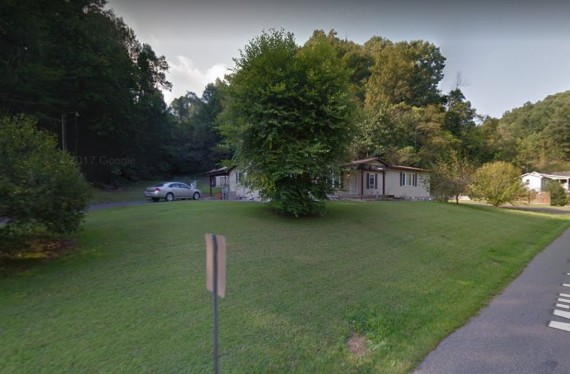 Showing the carport and shed