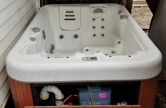 Hot Tub With Cover Just Outside The Back Door