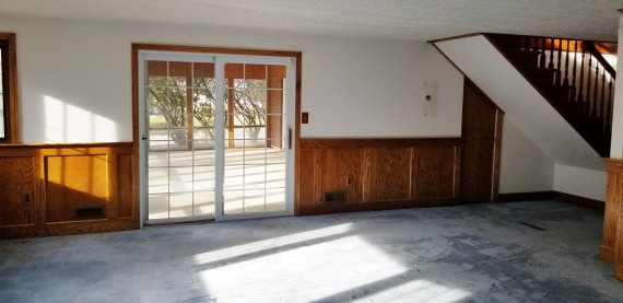 Sliding Glass Door Leading To Glass Enclosed Patio