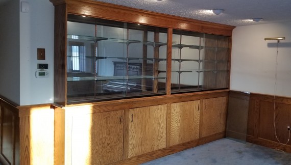 Built-in Sliding Glass Door Mirrored Display Case & Storage Shelves Below