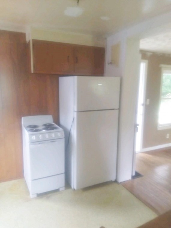 The kitchen refrigerator and electric stove stay with the Real Estate.