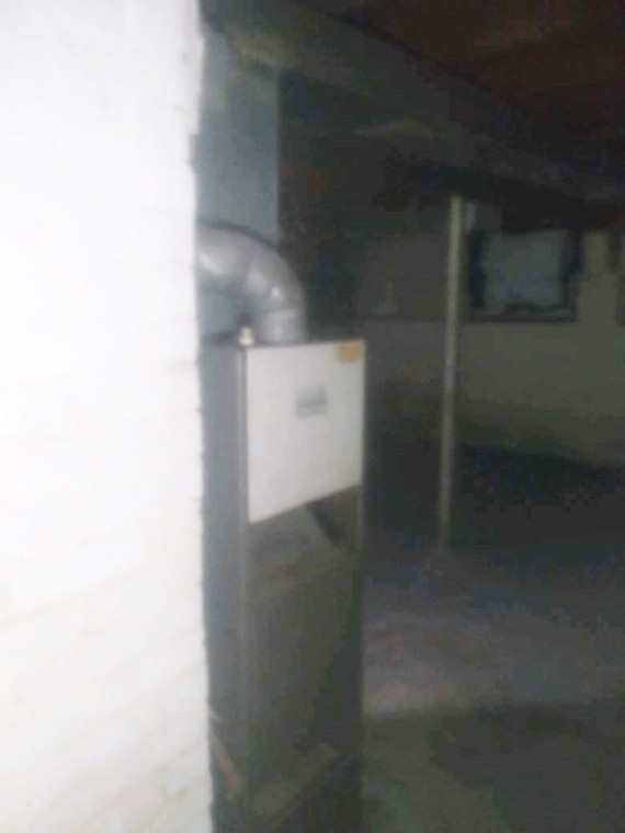 Concrete block foundation and the furnace.