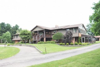 Great Home On 32.69 +/- Picturesque Acres with Outbuildings & Income Rentals