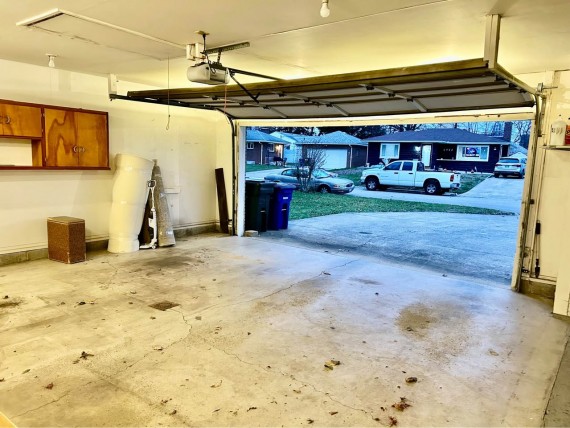 Huge 3 Car Finished Garage With Overhead Storage Space 