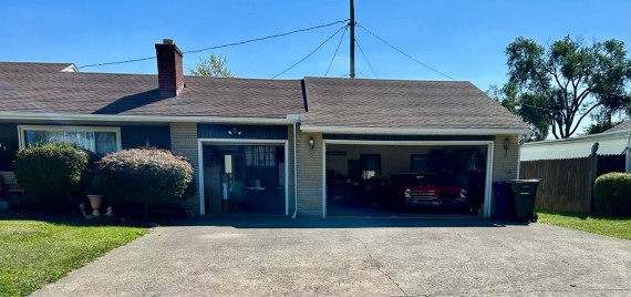 6 Car Concrete Driveway. 3 Car Attached Finished Garage.