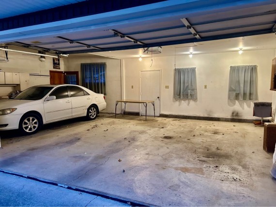 3 Car Attached Finished Garage With Overhead Storage Space