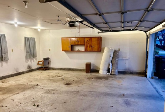 Huge 3 Car Finished Garage With Overhead Storage Space