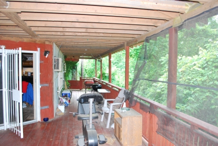 Covered back porch of owner's suite