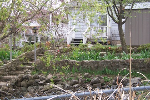 view of rock garden and back deck