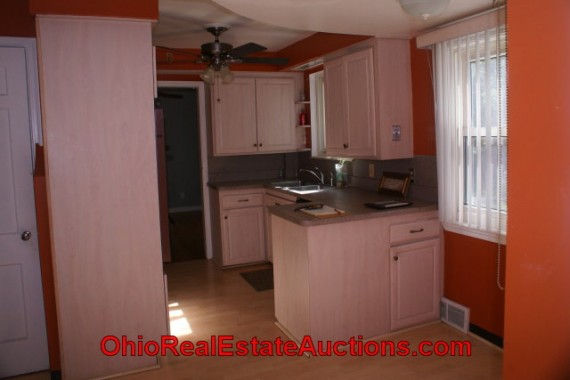 CONVENIENT KITCHEN WITH VIEW OF BACKYARD